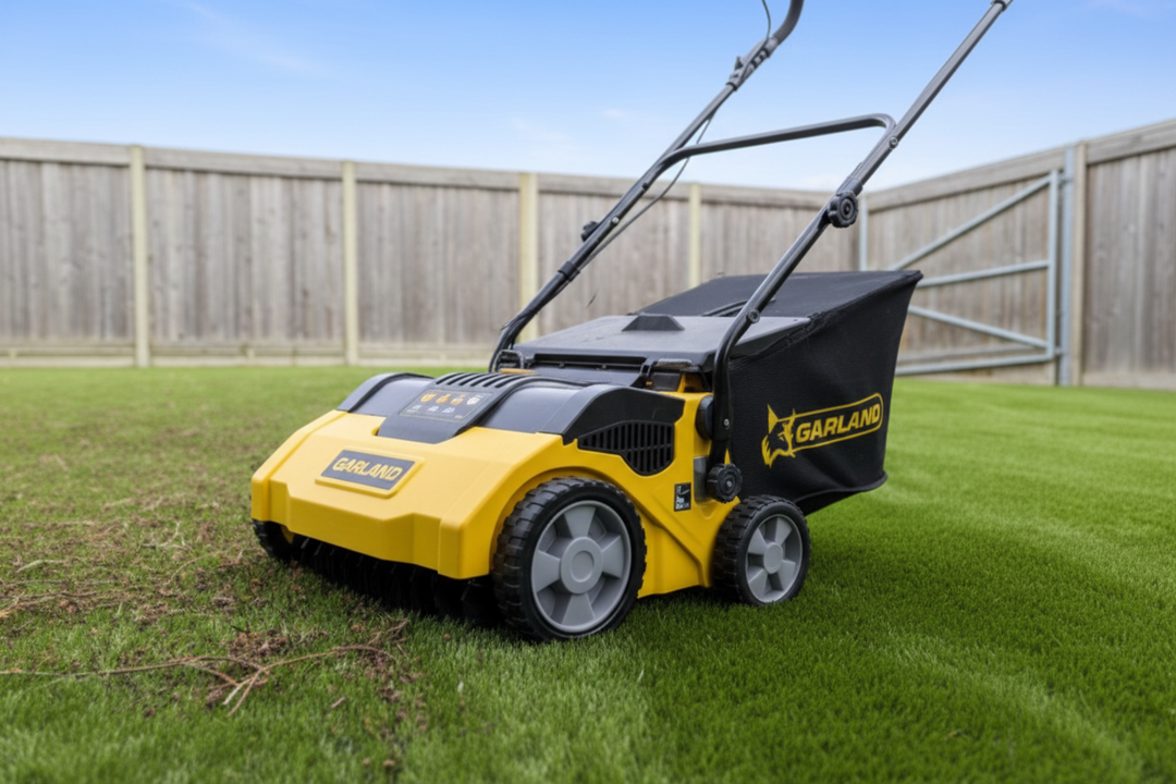 Garland electric artificial turf lawn sweeper in use on synthetic grass in an Australian backyard