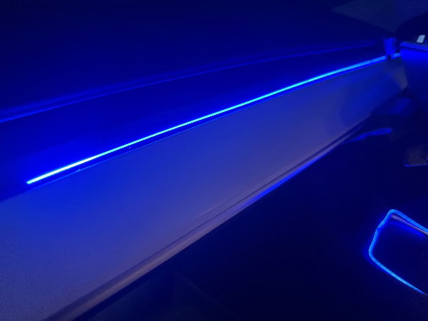 Close-up of a car's interior with blue LED strip lighting on Tesla BSD. #myteslaaccessoriesau