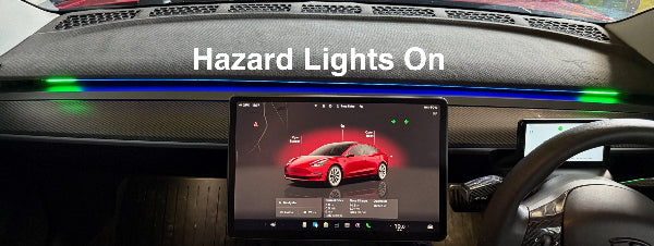 Tesla dashboard with digital display Blind Spot Detection showing a red car icon and 'Hazard Lights On'