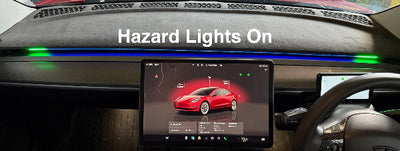 Tesla dashboard with digital display Blind Spot Detection showing a red car icon and 'Hazard Lights On'