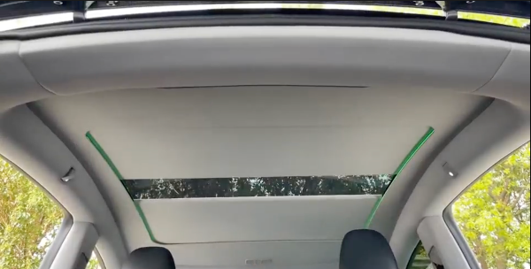 Electric Sunshade For Tesla Moel Y Juniper in part open position 