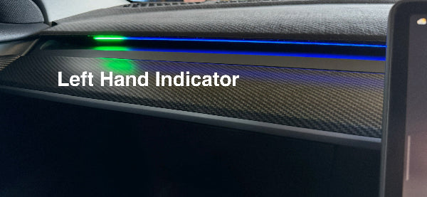 Car dashboard with left hand indicator lights showing for the Tesla Blind Spot Detection