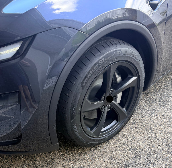 Tesla rim cap kit and valve caps in Silver and Black on Juniper Model Y