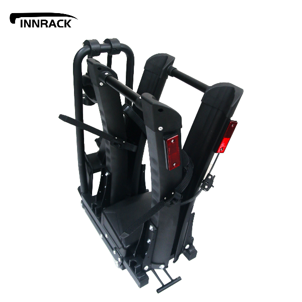 Black folding bike rack with reflectors on a white background, featuring the INNRACK brand.
