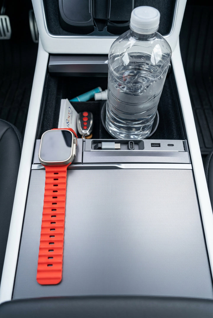 USB docking Hub with water bottle coer closed in the Tesla YL with watch charging adn cord retracted
