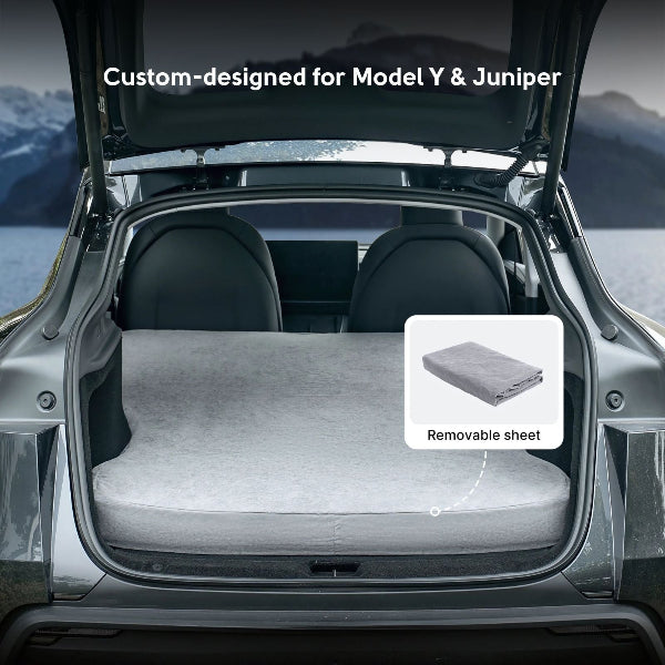 Car trunk with a custom-designed sleeping mattress and removable sheet, suitable for Model Y and Juniper.