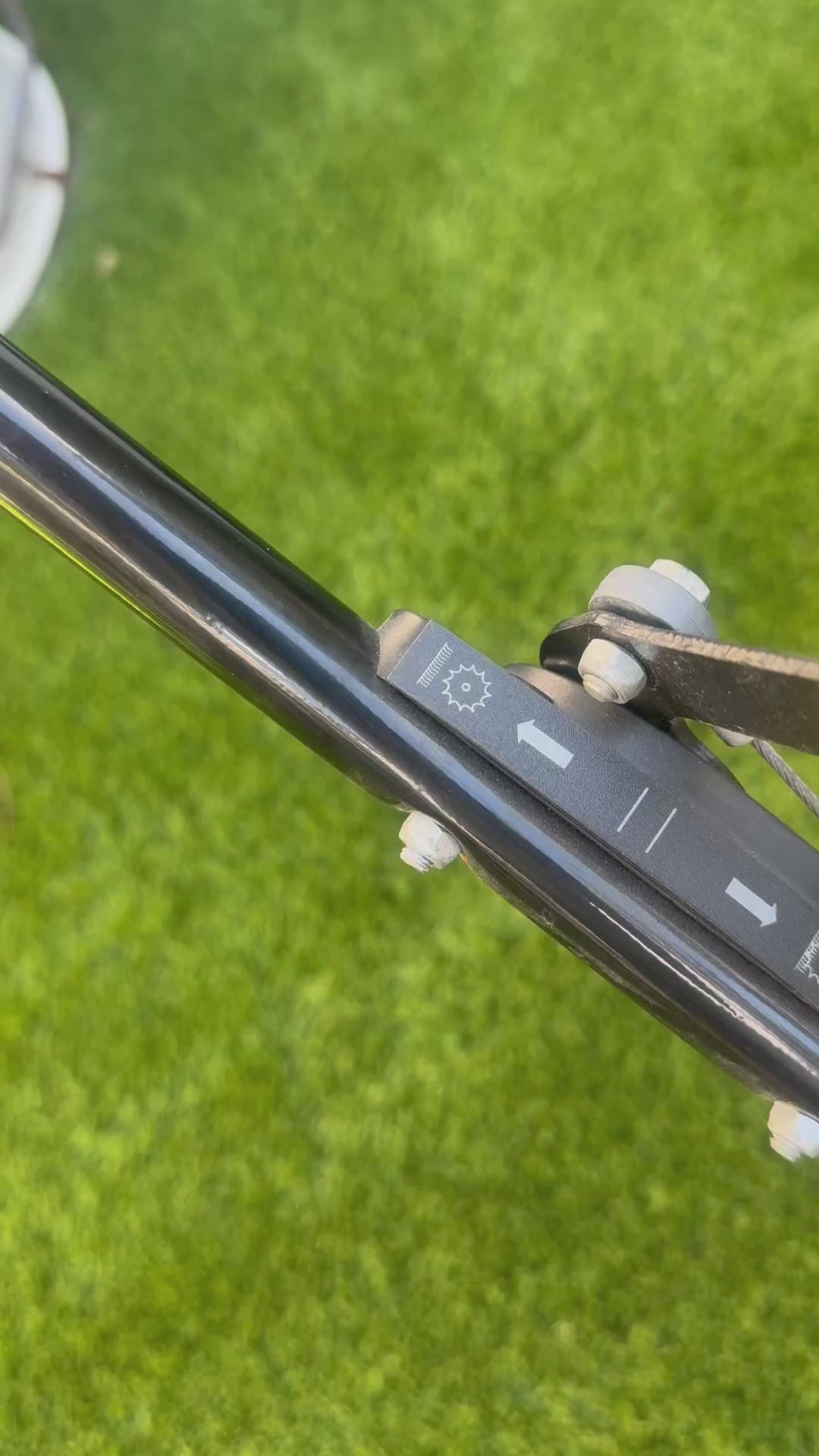 Using the raise and lower of the brush for the 602W Artifical Lawn Sweeper