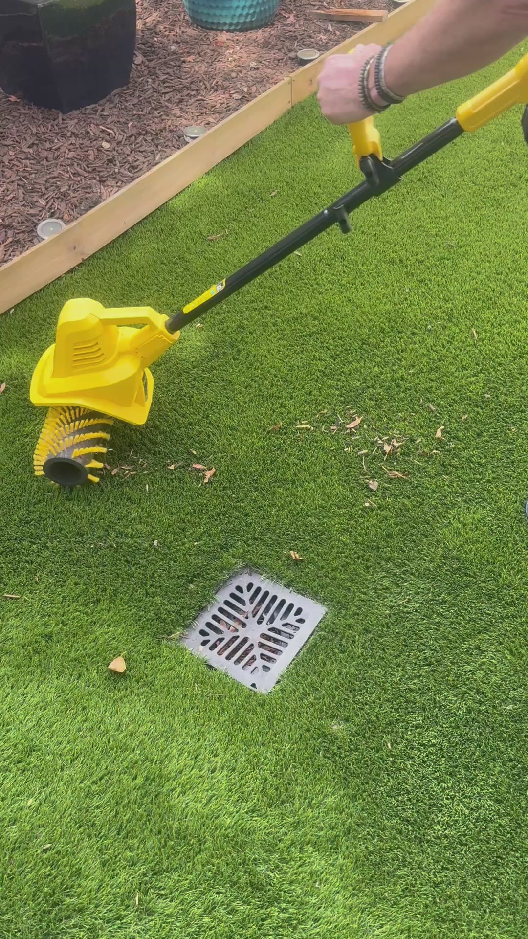 141W Artificial Lawn Sweeper In yard sweeping leaves