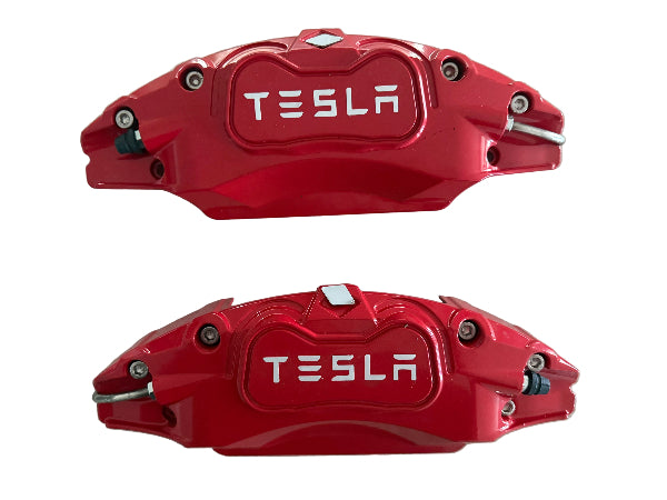 Two red Tesla rear brake calipers 