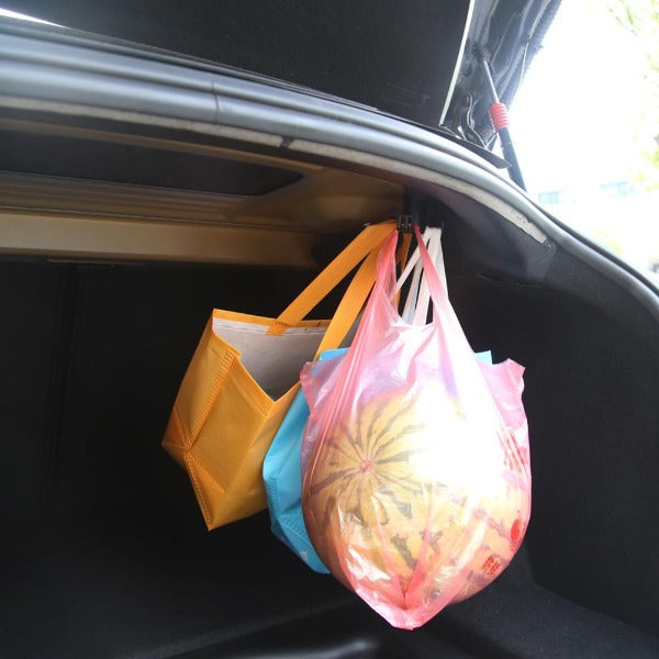 The Tesla Rear Trunk Bag Hook is a great accessory for any Tesla owner who wants to maximize their storage space. This hook is designed to be strong and durable, so it can hold up to 15kg of cargo. It can be used for groceries, sports equipment, beach gear, and other items. The hook also folds up when not in use so it 